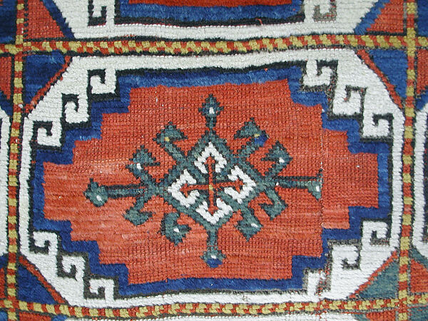 Carpet with Repeating Medallion Pattern on Red Background, Wool; (warp, weft, and pile); symmetrically knotted pile