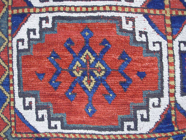 Carpet with Repeating Medallion Pattern on Red Background, Wool; (warp, weft, and pile); symmetrically knotted pile