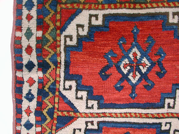 Carpet with Repeating Medallion Pattern on Red Background, Wool; (warp, weft, and pile); symmetrically knotted pile