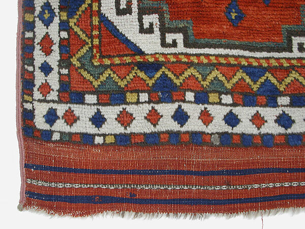 Carpet with Repeating Medallion Pattern on Red Background, Wool; (warp, weft, and pile); symmetrically knotted pile