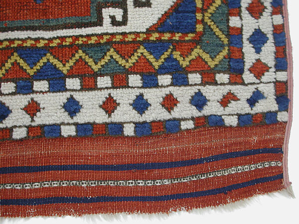 Carpet with Repeating Medallion Pattern on Red Background, Wool; (warp, weft, and pile); symmetrically knotted pile