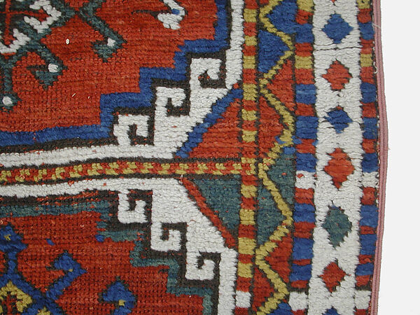 Carpet with Repeating Medallion Pattern on Red Background, Wool; (warp, weft, and pile); symmetrically knotted pile
