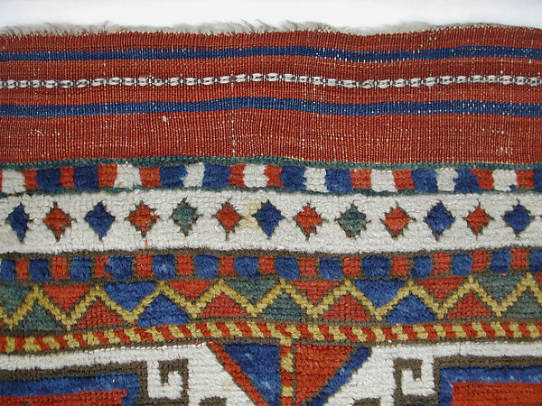 Carpet with Repeating Medallion Pattern on Red Background, Wool; (warp, weft, and pile); symmetrically knotted pile