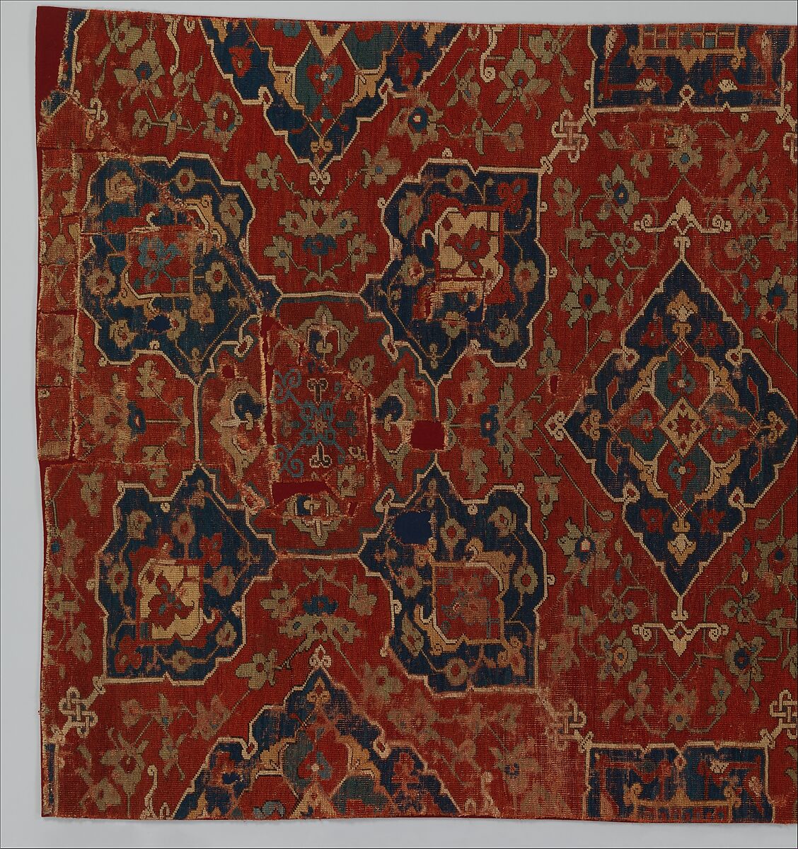 Fragment of a Carpet with Quatrefoil Design, Wool (warp, weft, and pile); symmetrically knotted pile