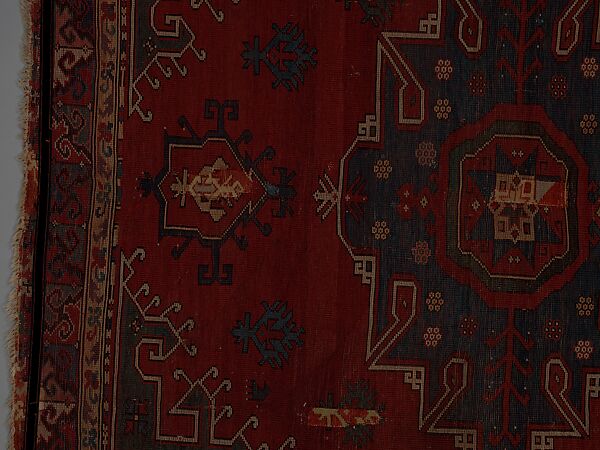 Tribal Carpet with Medallion Design, Wool (warp, weft, and pile); symmetrically knotted pile