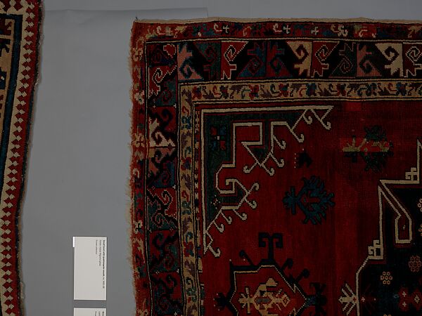 Tribal Carpet with Medallion Design, Wool (warp, weft, and pile); symmetrically knotted pile