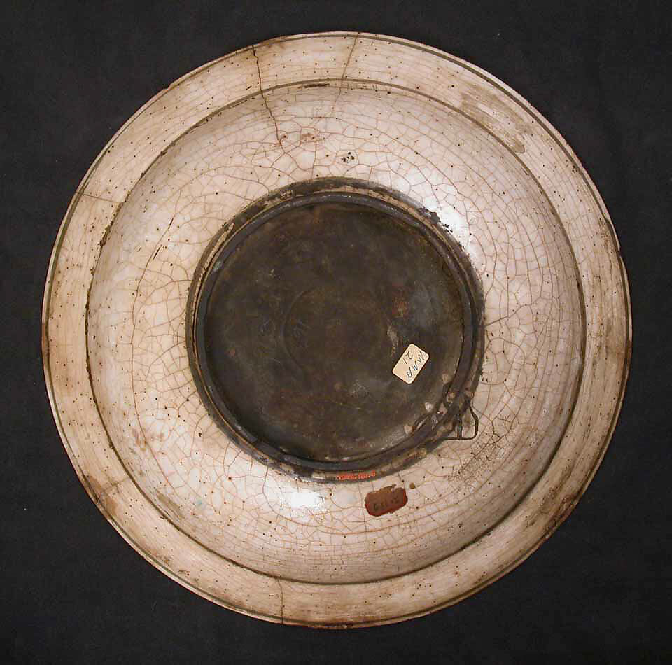 Dish, Stonepaste; underglaze painted in black, blue, and green with red and yellow slips