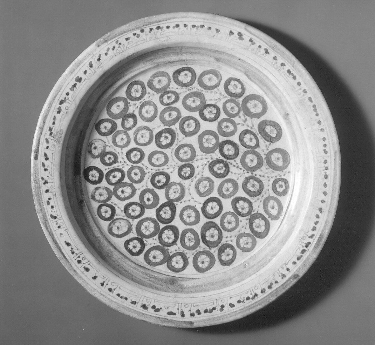 Plate Depicting a Flowering Bush in Two-Toned Luster, Earthenware; luster-painted on opaque white glaze