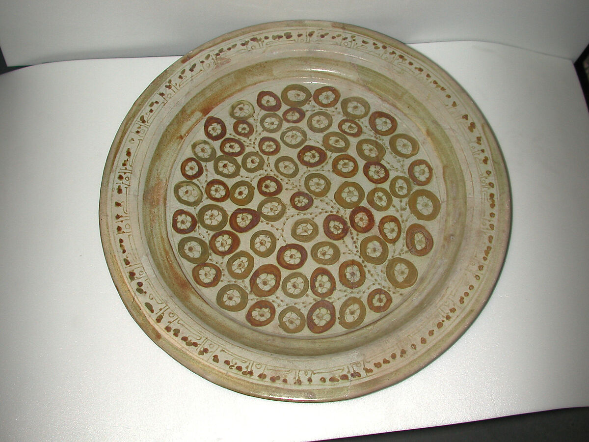 Plate Depicting a Flowering Bush in Two-Toned Luster, Earthenware; luster-painted on opaque white glaze