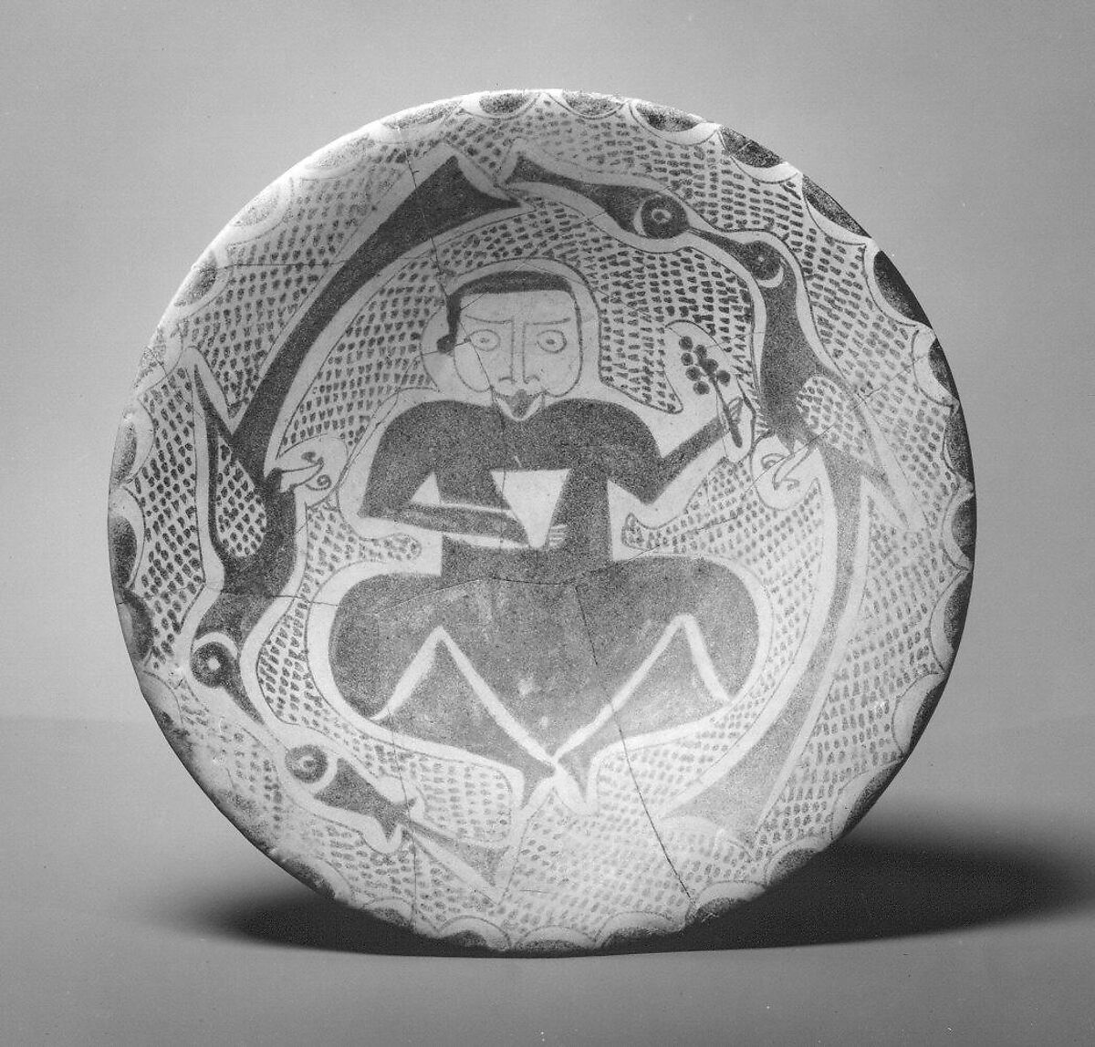 Bowl depicting a Man holding a Cup and a Flowering Branch, Earthenware; luster-painted on opaque white glaze