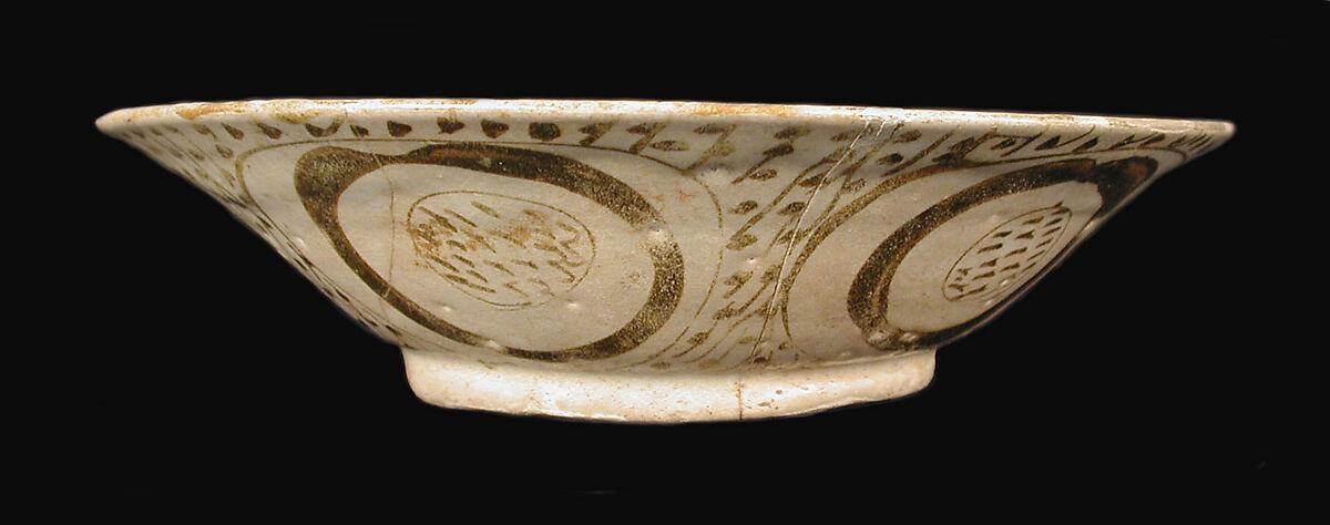 Bowl depicting a Man holding a Cup and a Flowering Branch, Earthenware; luster-painted on opaque white glaze