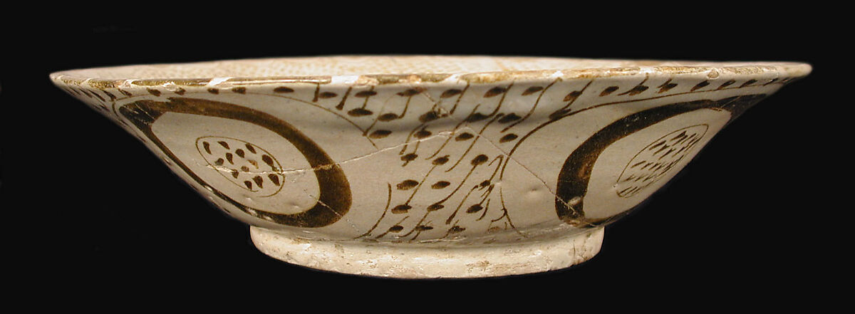 Bowl depicting a Man holding a Cup and a Flowering Branch, Earthenware; luster-painted on opaque white glaze