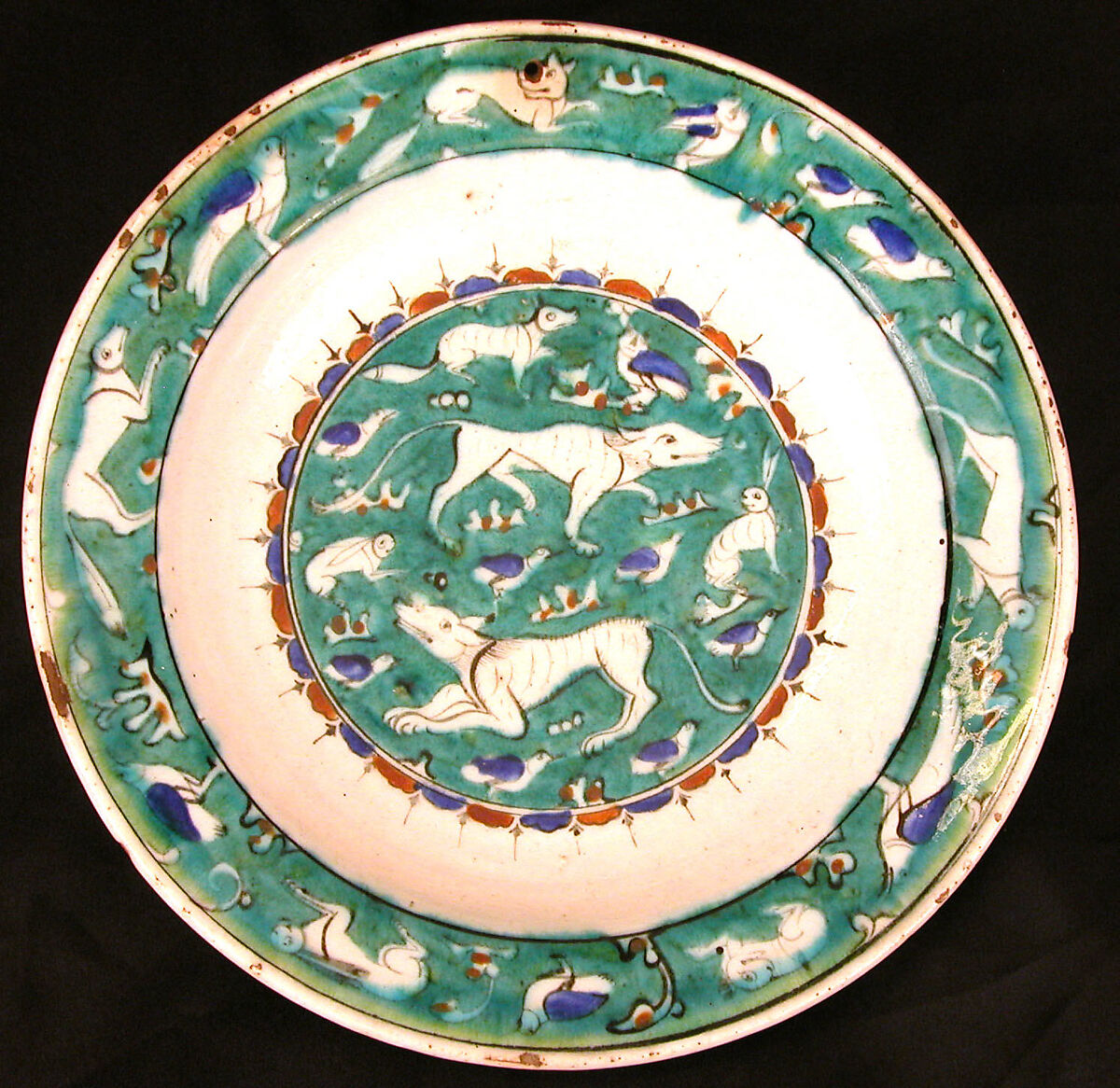 Dish with Bird, Rabbit, and Quadruped Design, Stonepaste; polychrome painted under transparent glaze 
