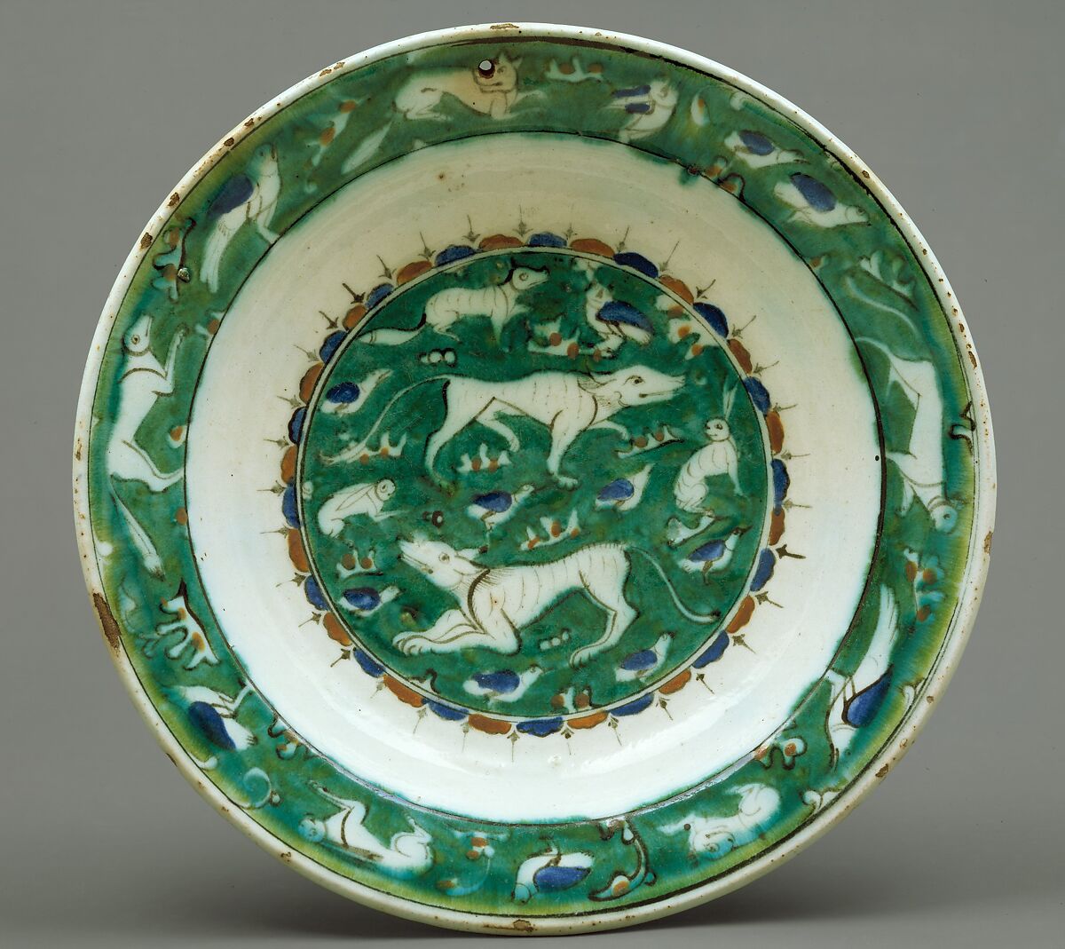 Dish with Bird, Rabbit, and Quadruped Design, Stonepaste; polychrome painted under transparent glaze