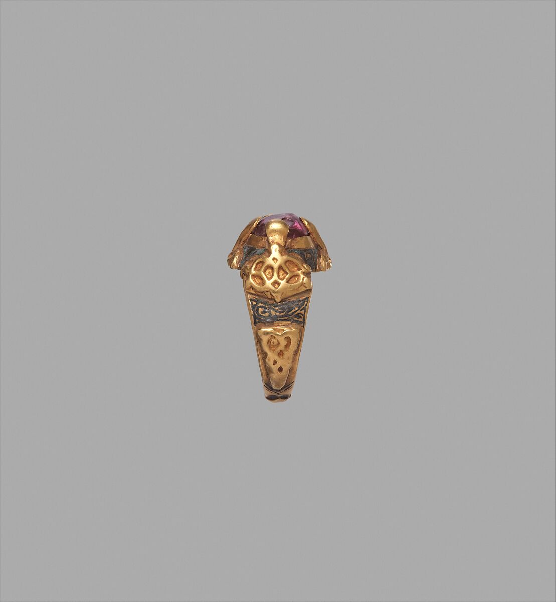 Ring, Gold; cast and fabricated from sheet, decorated with bitumen-highlighted incising, set with tourmaline bead