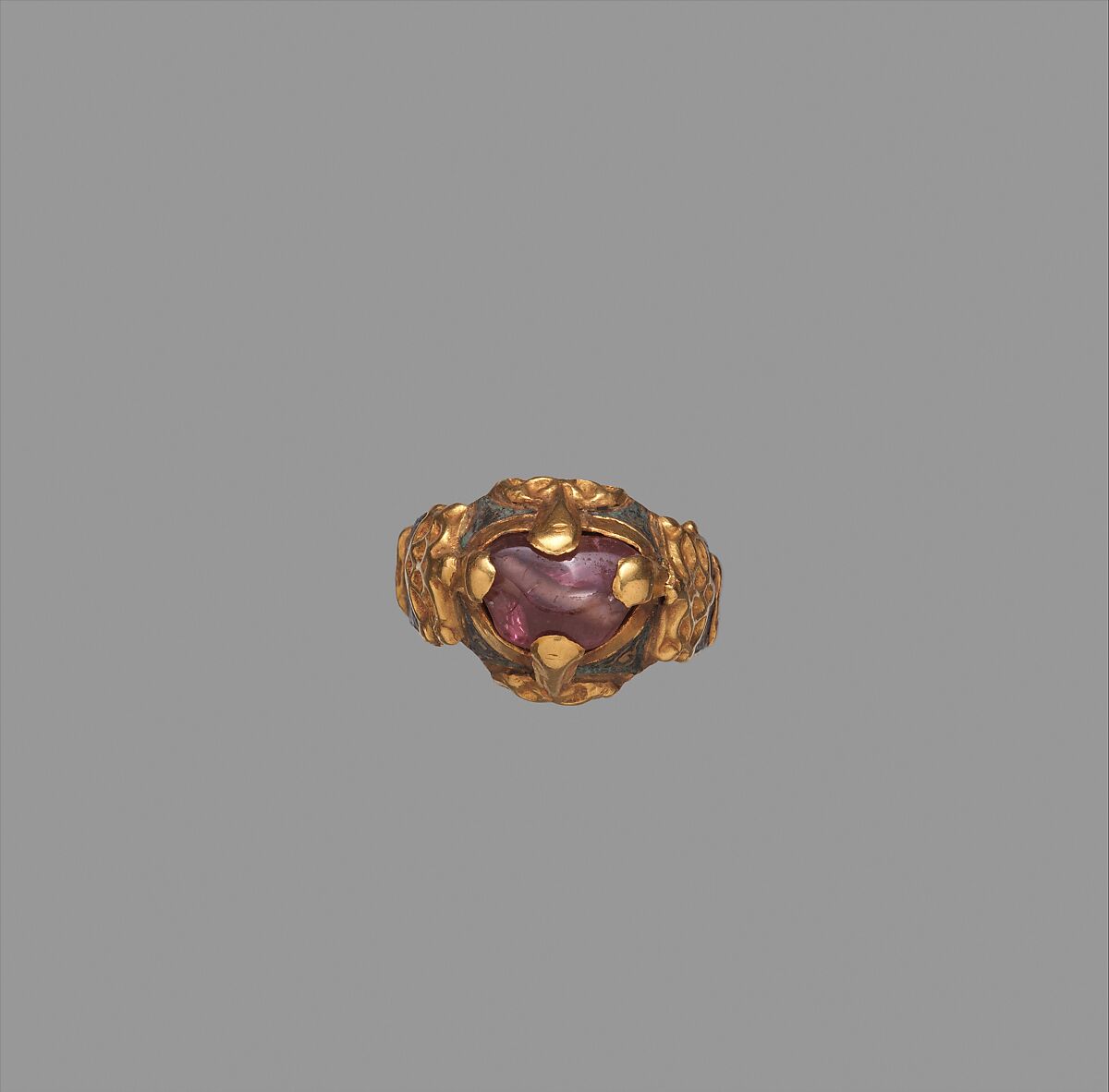 Ring, Gold; cast and fabricated from sheet, decorated with bitumen-highlighted incising, set with tourmaline bead