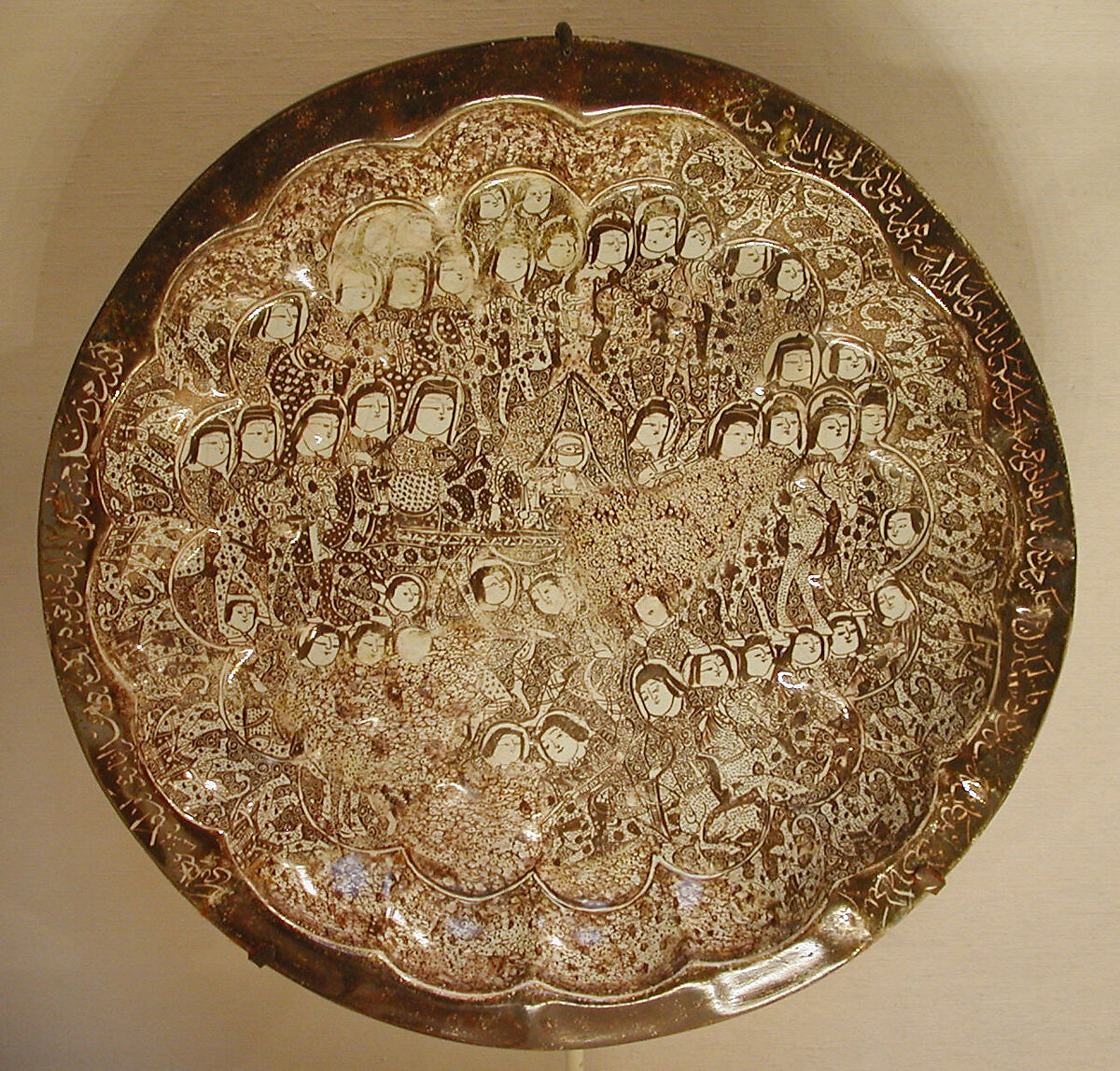 Dish depicting a Wedding Procession, Stonepaste; molded, luster-painted on opaque white glaze