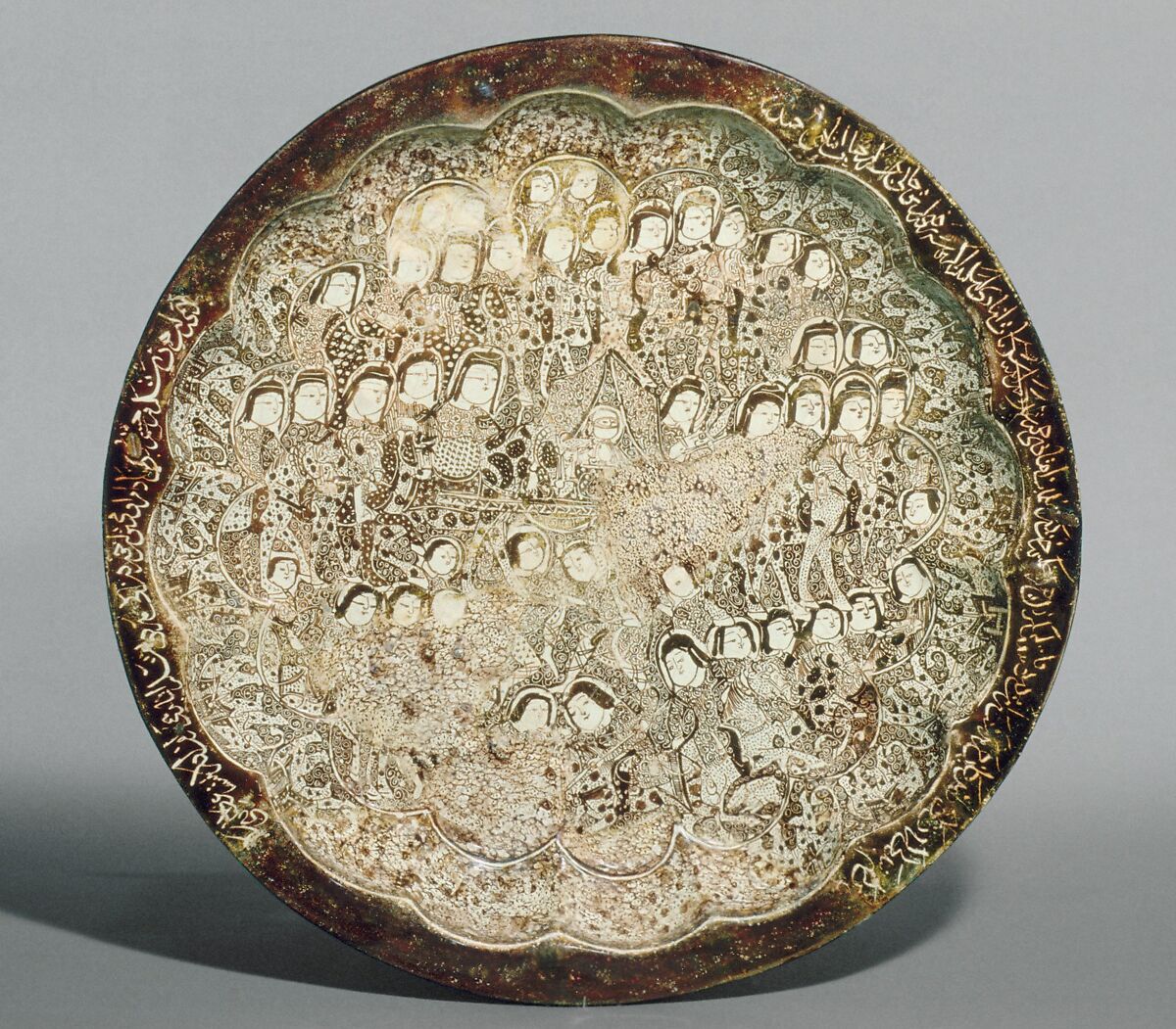 Dish depicting a Wedding Procession, Stonepaste; molded, luster-painted on opaque white glaze