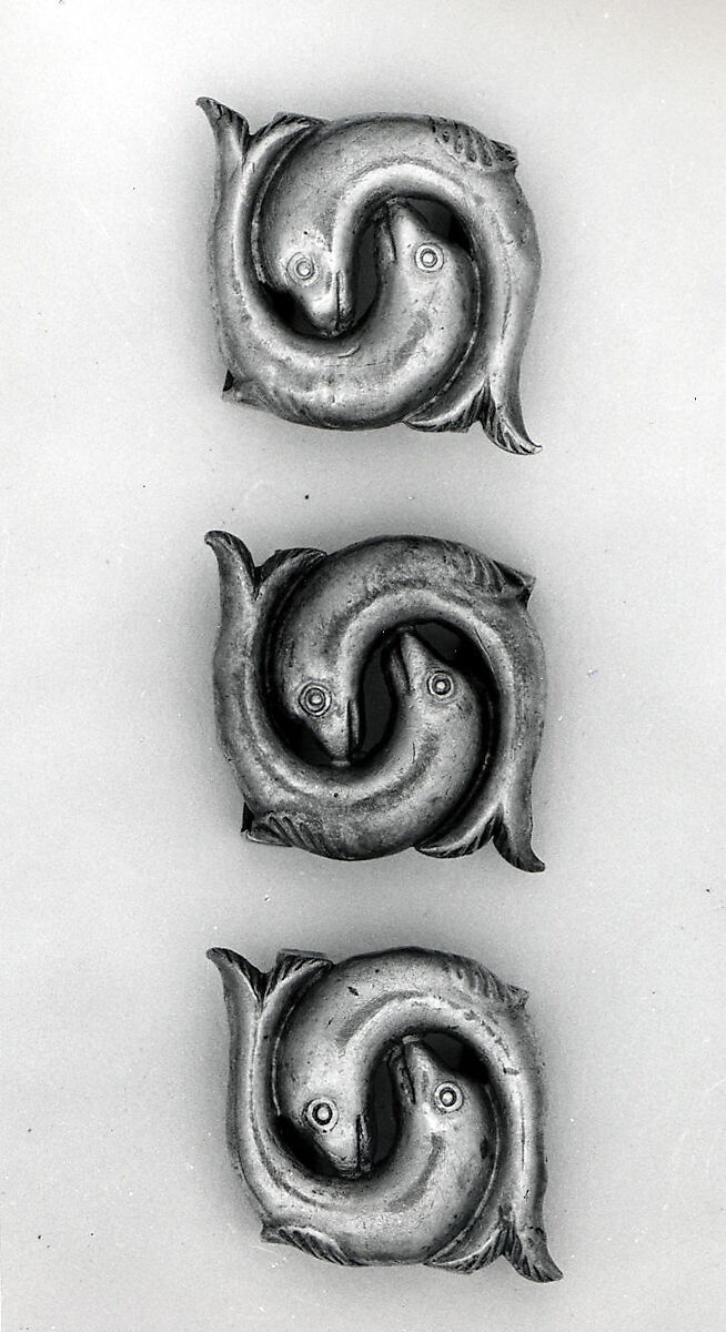 Three Ornaments from a Bridle, Silver; stamped, punched, gilded 