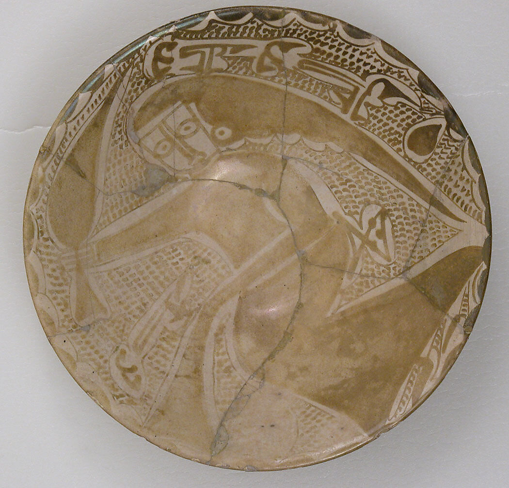 Luster Bowl with a Seated Figure and “Baraka” (Blessing) Written Under the Base, Earthenware; luster-painted on opaque white glaze  