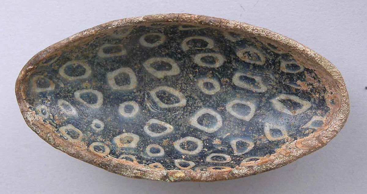 Small Millefiori Bowl, Glass, blue and opaque white mosaic; fused and slumped, probably ground and polished, applied disk foot 