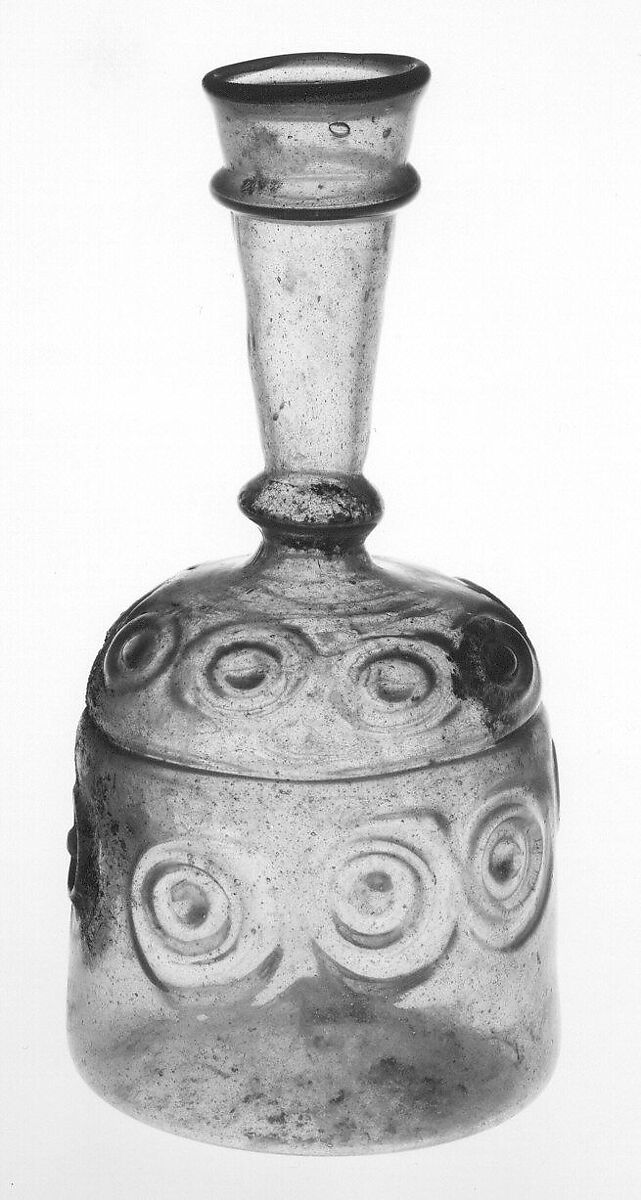 Bottle with Impressed Decorations, Glass, greenish yellow; blown in two parts, impressed with tongs, applied blue rim