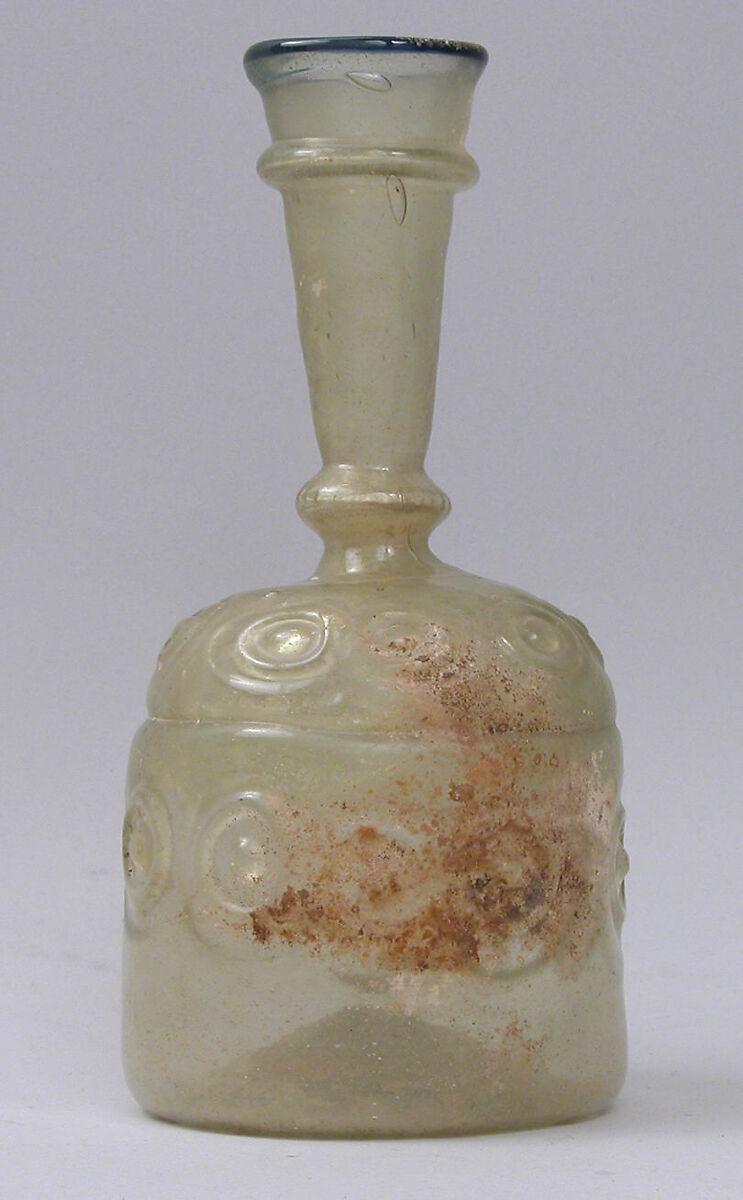 Bottle with Impressed Decorations, Glass, greenish yellow; blown in two parts, impressed with tongs, applied blue rim