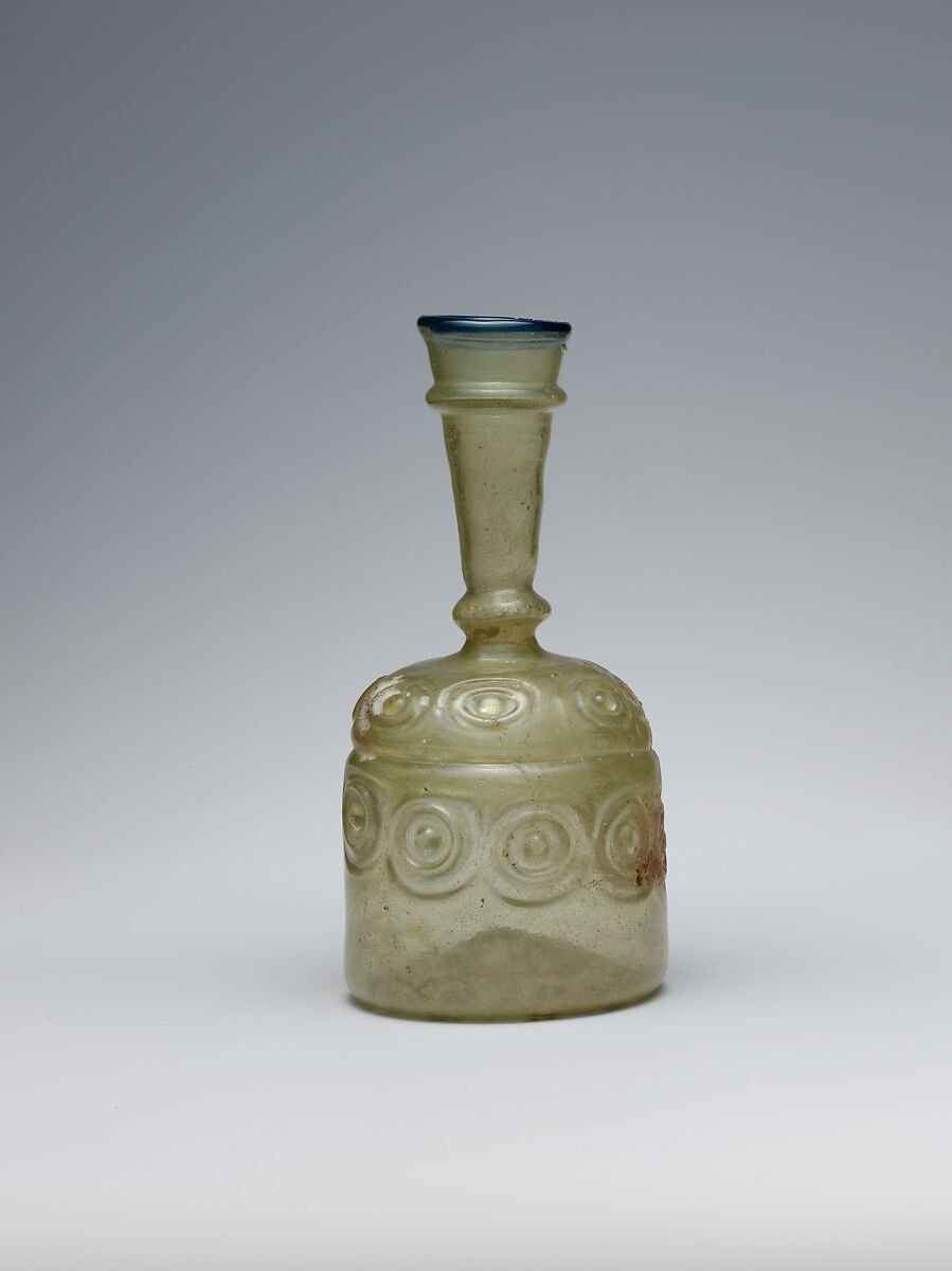 Bottle with Impressed Decorations, Glass, greenish yellow; blown in two parts, impressed with tongs, applied blue rim