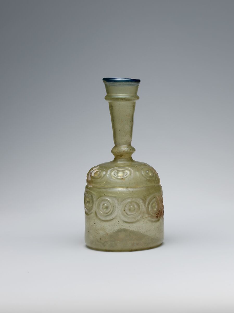 Bottle with Impressed Decorations, Glass, greenish yellow; blown in two parts, impressed with tongs, applied blue rim 