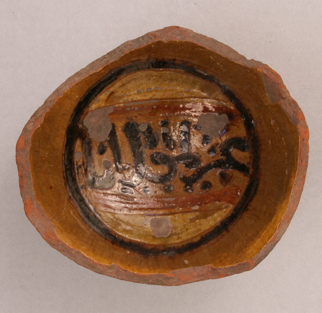 Fragment of a Bowl, Earthenware; slip-painted under transparent glaze 