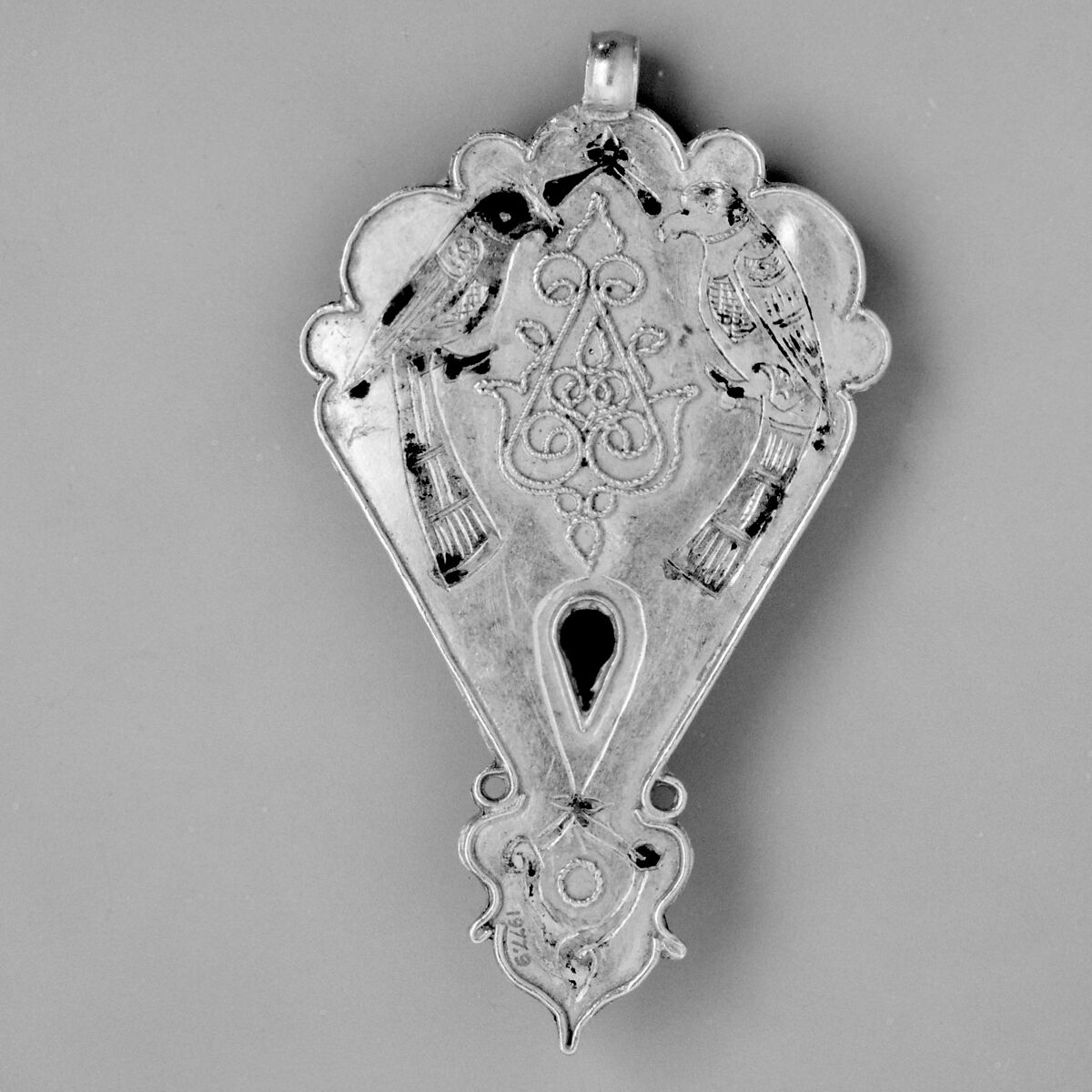 Pendant, Gold, fabricated from sheet, decorated with bitumen-highlighted incising, twisted wire, and granulation, set with garnets, turquoise, and other precious stones, probably tourmalines
