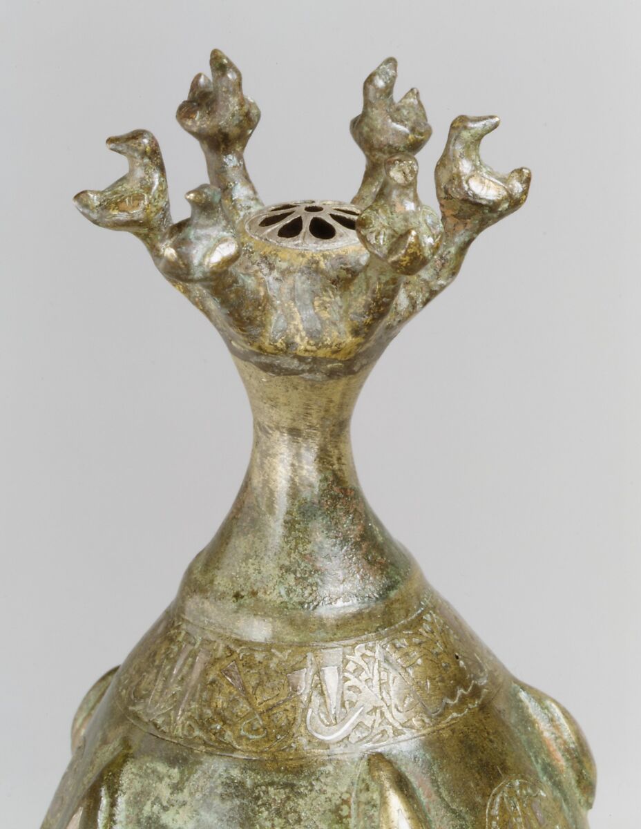 Bottle with Sprinkler Top, Quaternary alloy; cast, engraved, inlaid with silver and copper