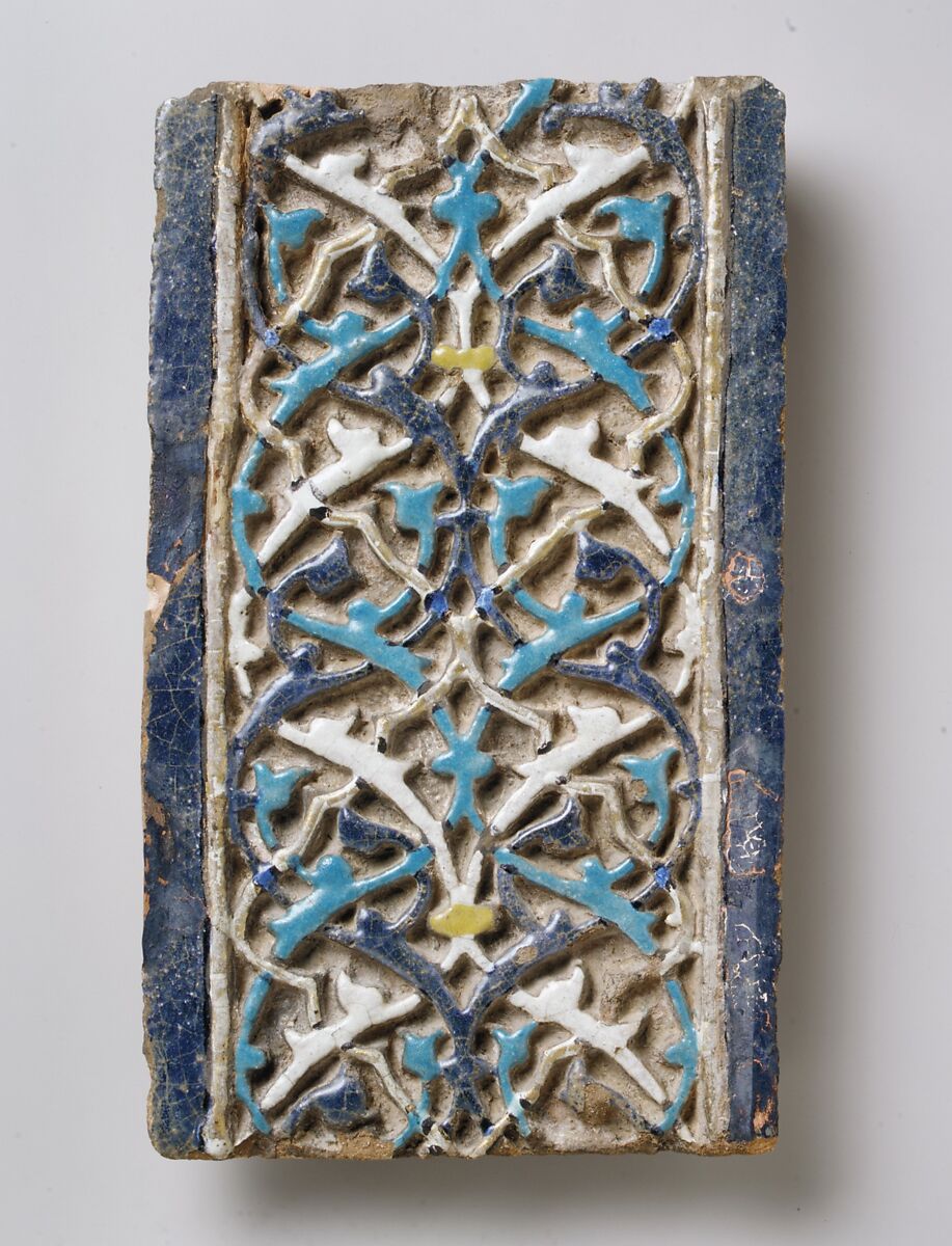 Tile, Tempered earthenware; molded; polychrome glazed within black wax resist outlines (cuerda seca technique); gilded