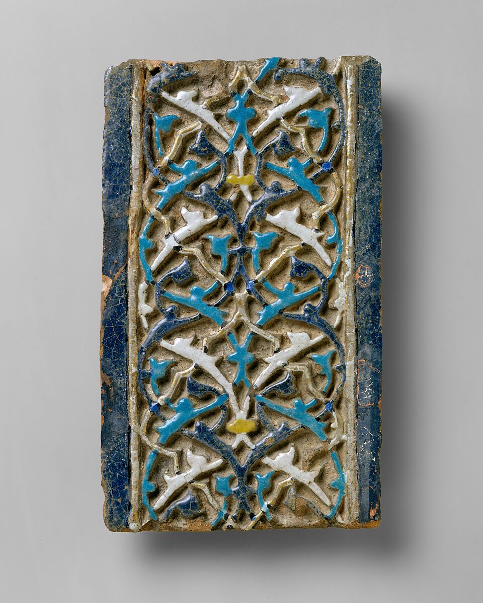 Tile, Tempered earthenware; molded; polychrome glazed within black wax resist outlines (cuerda seca technique); gilded