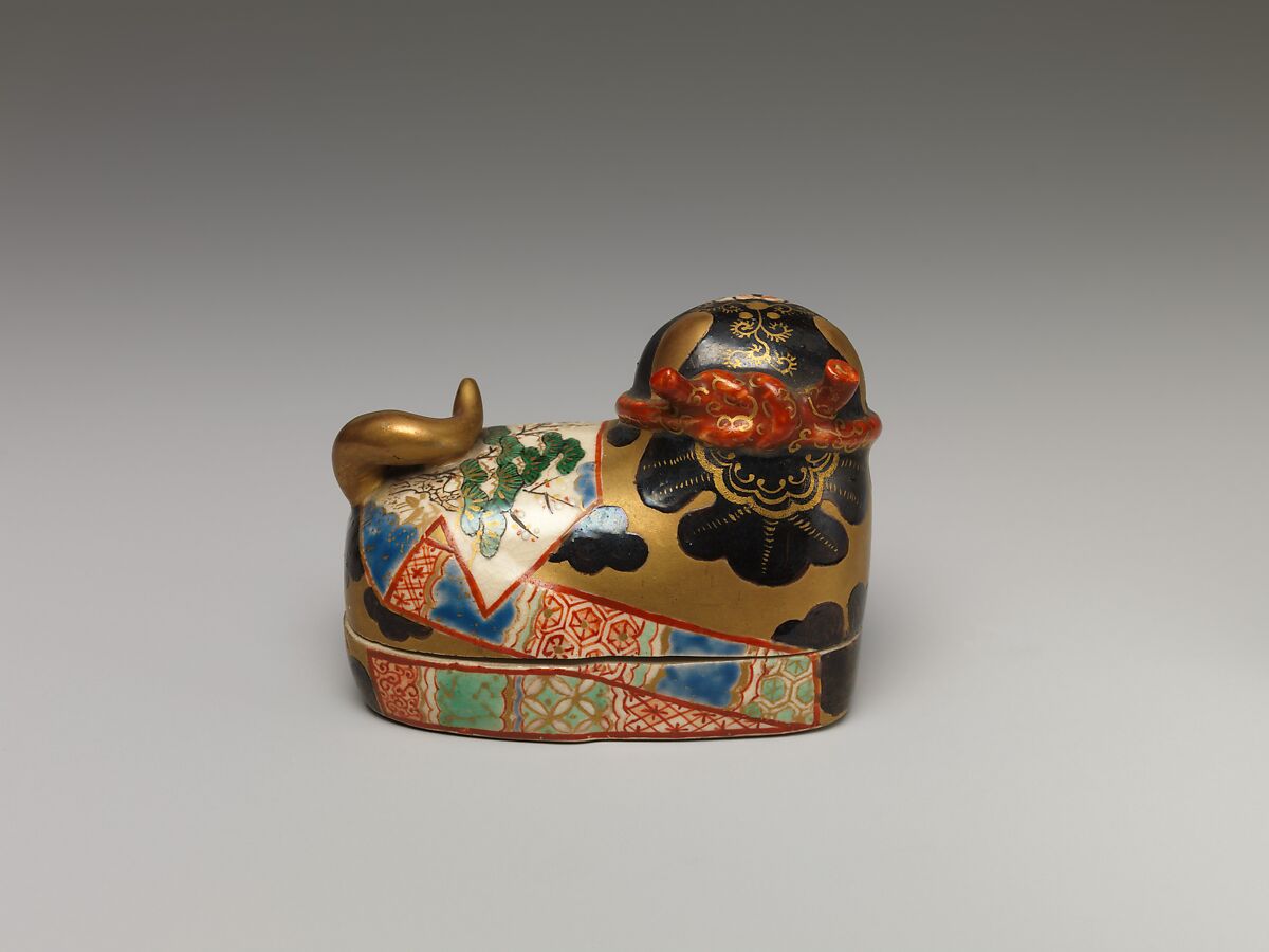 One of a Pair of Incense Boxes in the Shape of Dog Charms, Porcelain with overglaze enamels (Minpei kilns), Japan
