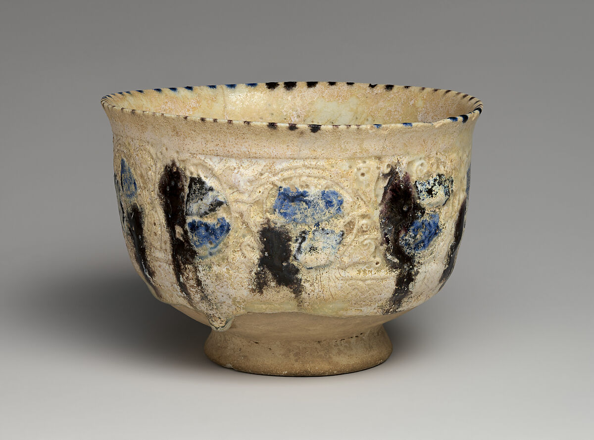 Bowl with Revolving Scrolls, Stonepaste; molded, pierced, incised, painted, and glazed 