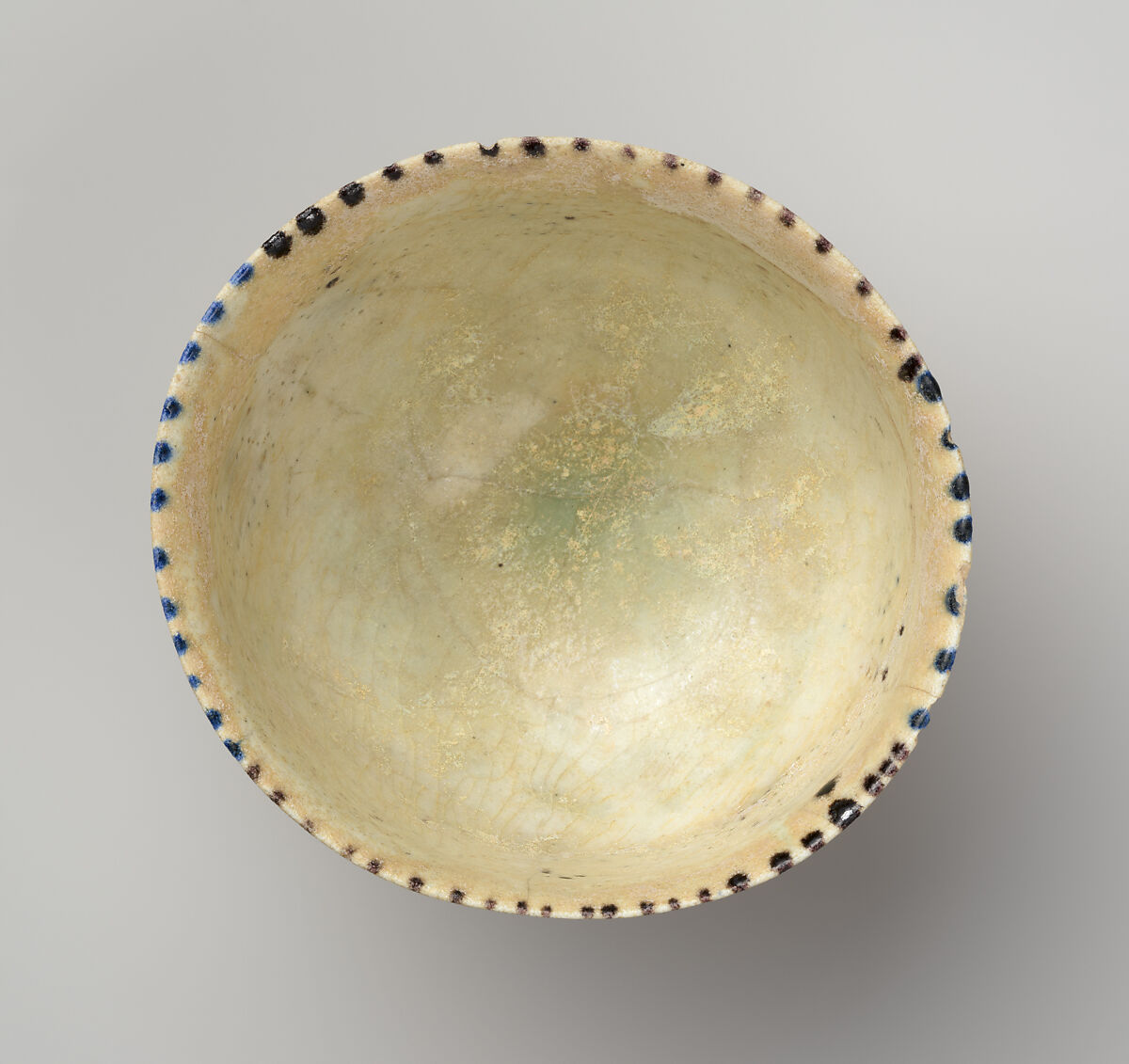 Bowl with Revolving Scrolls, Stonepaste; molded, pierced, incised, painted, and glazed