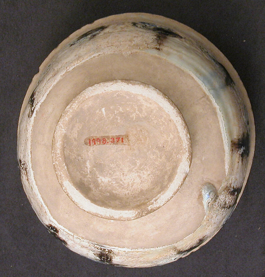 Bowl with Revolving Scrolls, Stonepaste; molded, pierced, incised, painted, and glazed