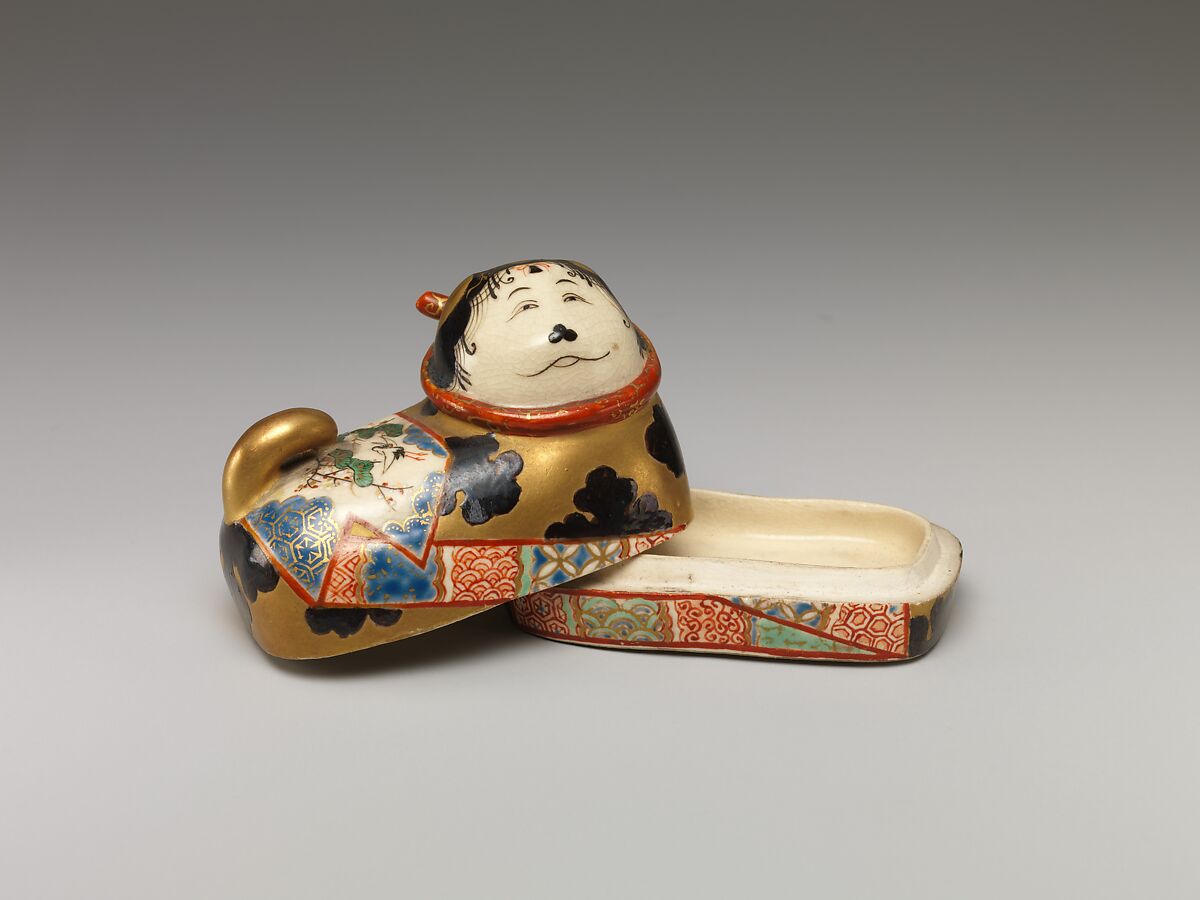 One of a Pair of Incense Boxes in the Shape of Dog Charms, Porcelain with overglaze enamels (Minpei kilns), Japan
