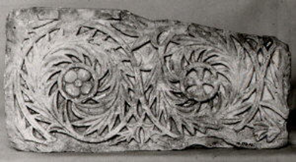 Fragment of a Frieze with Scrolls Enclosing a Rosette and a Cross, Limestone; carved in relief 