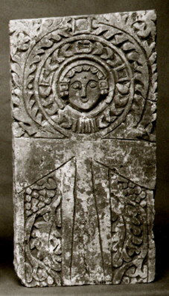 Funerary Stele with Ankh (Looped Cross) Featuring a Human Face at the Center, Limestone; carved in relief