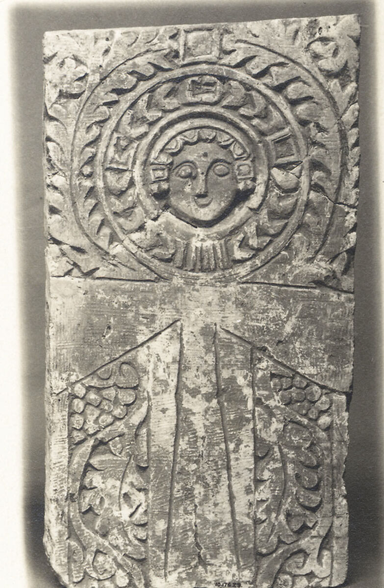 Funerary Stele with Ankh (Looped Cross) Featuring a Human Face at the Center, Limestone; carved in relief 