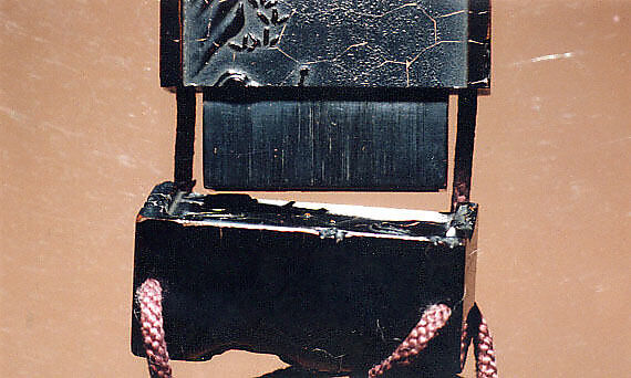 Case (Inrō) in the Shape of an Ink Stick with Design of God of Longevity (Jurōjin), Reading beneath a Star Constellation (obverse);Twelve-Character Inscription (reverse), Shibata Zeshin (Japanese, 1807–1891), Roiro (waxen) lacquer with black hiramakie sprinkled and polished lacquer and takamakie sprinkled and polished lacquer relief; Interior: roiro; Netsuke: lacquer in shape of a worn ink stick; Ojime: black lacquer bead, Japan