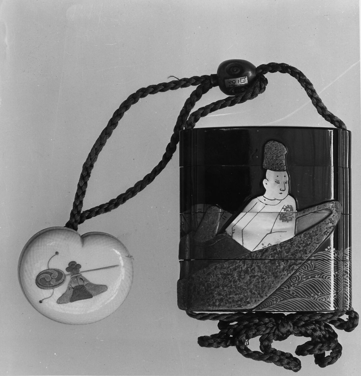 Case (Inrō) with Design of Courtier and Lady in a Boat (from the Tale of Genji), After Ogata Kōrin (Japanese, 1658–1716), Gold maki-e and mother-of-pearl inlay 
Ojime: wood-and-gilt bead in shape of sake bottle 
Netsuke: ivory with lacquer design of toys, Japan