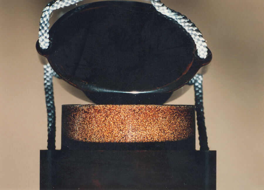 Case (Inrō) with Design of Bugaku Hat (obverseI; Shō Flute and Cymbals (reverse), Sprinkled gold lacquer with inlaid mother-of-pearl, pottery, and pewter; Interior: nashiji and fundame; Ojime: marble; Netsuke: wood with lacquer decoration of books, Japan