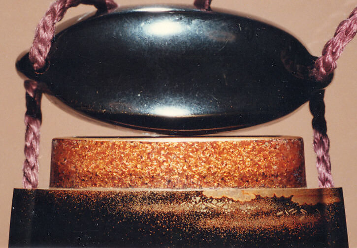 Case (Inrō) with Design of Chrysanthemums by a Stream, Sprinkled gold lacquer; Ojime: agate, Netsuke: carved wood frog on old bucket, Japan