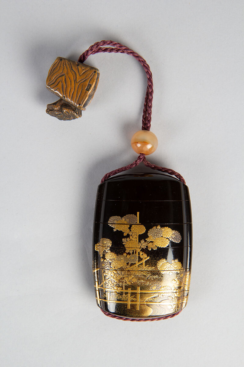 Case (Inrō) with Design of Chrysanthemums by a Stream, Sprinkled gold lacquer; Ojime: agate, Netsuke: carved wood frog on old bucket, Japan