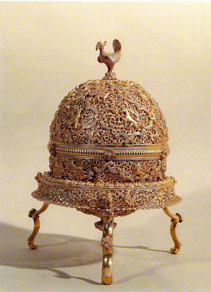 Goa Stone and Gold Case, Container: gold; pierced, repoussé, with cast legs and finials
Goa stone: compound of organic and inorganic materials
