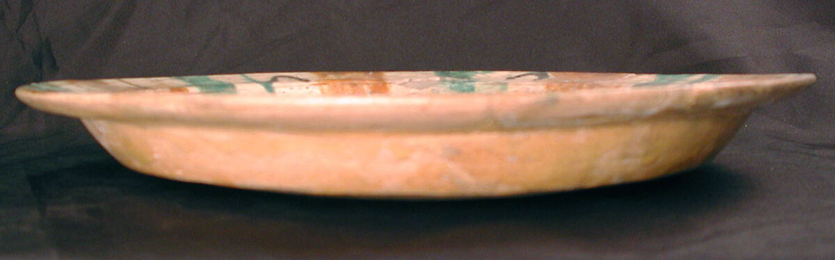 Plate, Earthenware; white slip, incised and glazed