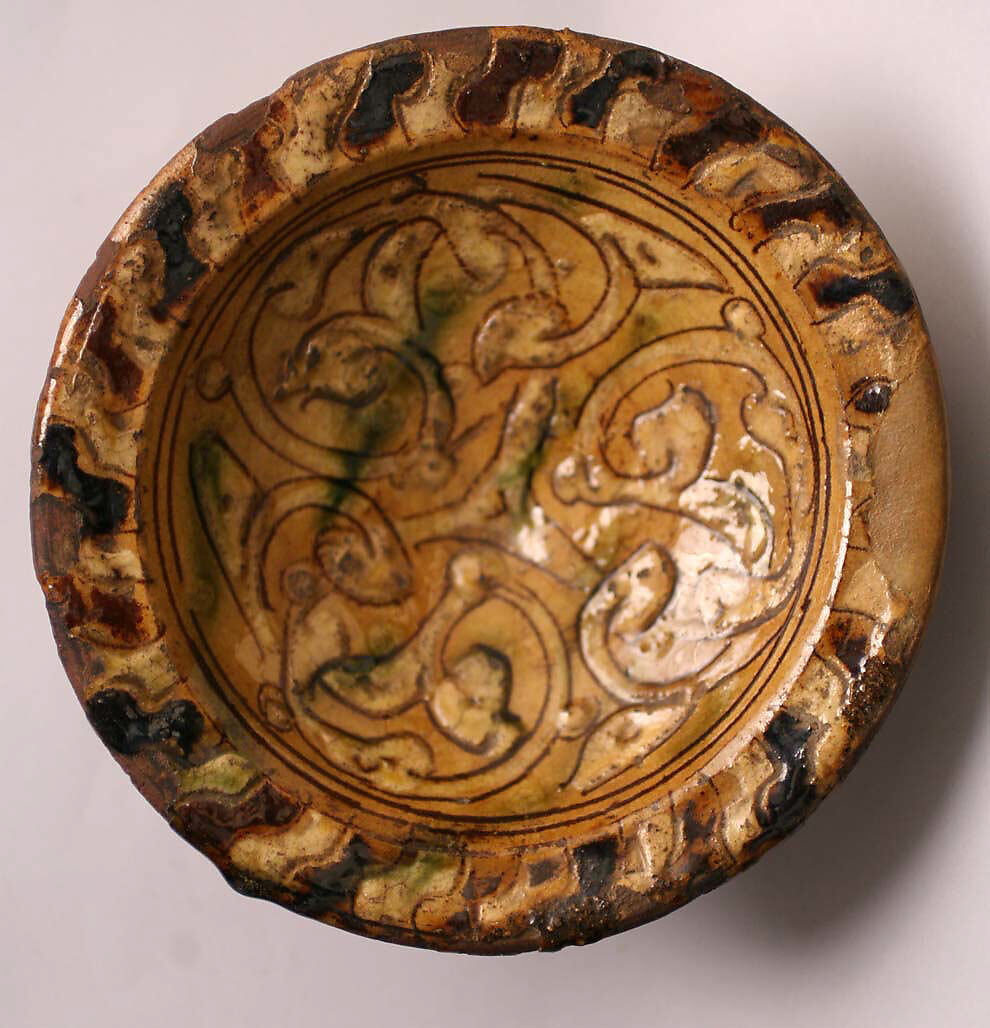 "Sgraffito-ware" Bowl, Red earthenware; white slip-covered with incised and brown slip decoration under polychrome transparent glazes 